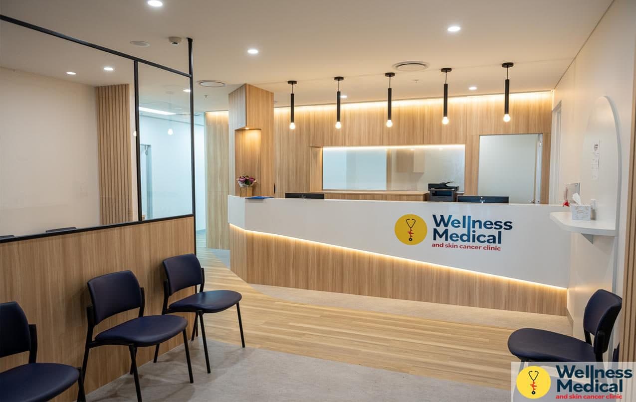 Wellness Medical Center — timber-clad reception with pendant lighting